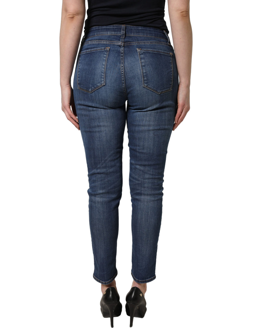 Jeans skinny déchirés bleu pastel de Dolce & Gabbana, taille mi-haute, en denim, avec détails usés et coupe ajustée.