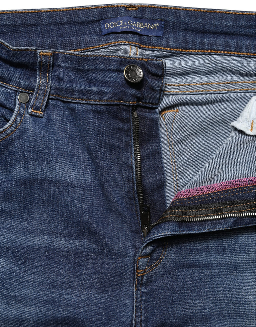 Jeans skinny déchirés en denim bleu à taille mi-haute de Dolce & Gabbana, style décontracté et tendance.