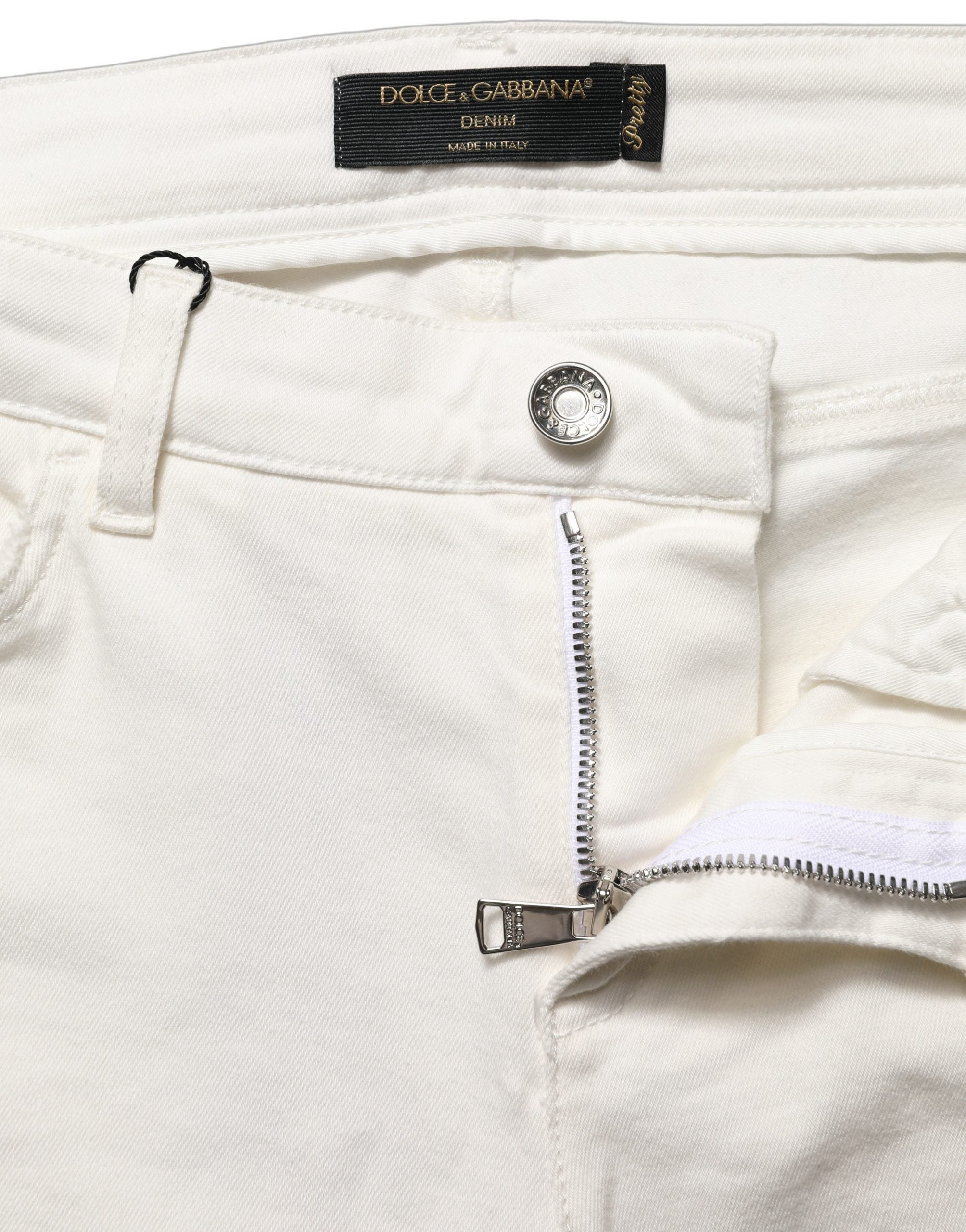 Jeans skinny en coton blanc déchiré de Dolce & Gabbana, style décontracté avec détails usés et coupe ajustée.