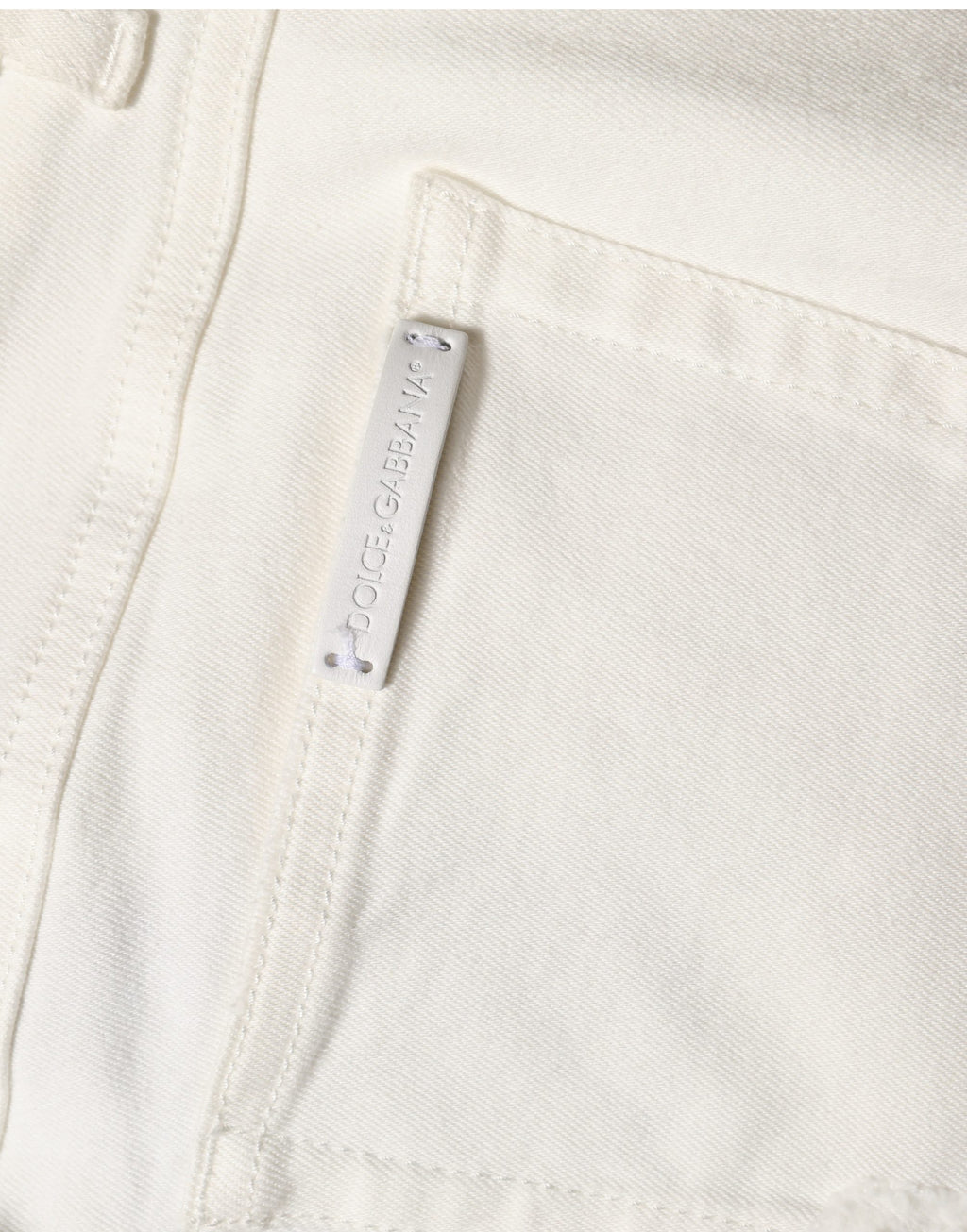 Jeans skinny en coton déchiré blanc de Dolce & Gabbana, style décontracté avec détails usés et coupe ajustée.