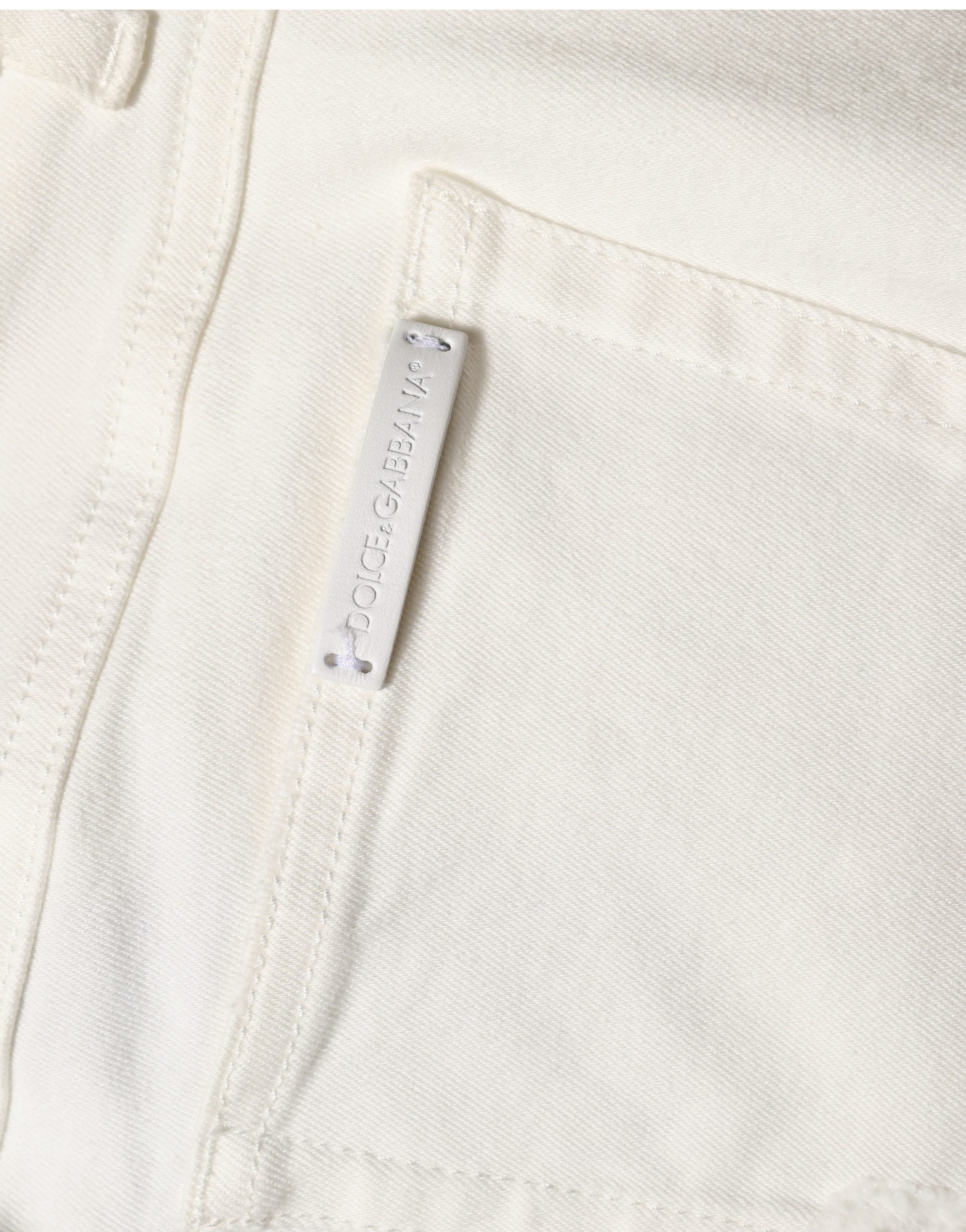 Jeans skinny en coton déchiré blanc de Dolce & Gabbana, style décontracté avec détails usés et coupe ajustée.