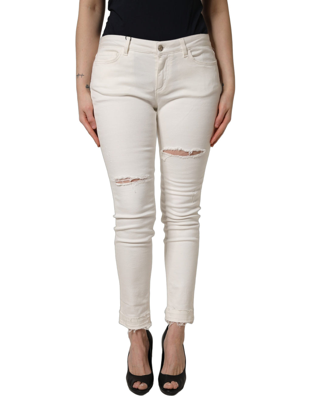 Jeans skinny en coton déchiré blanc Dolce & Gabbana, style moderne et tendance, visibles avec détails usés et coupe ajustée.