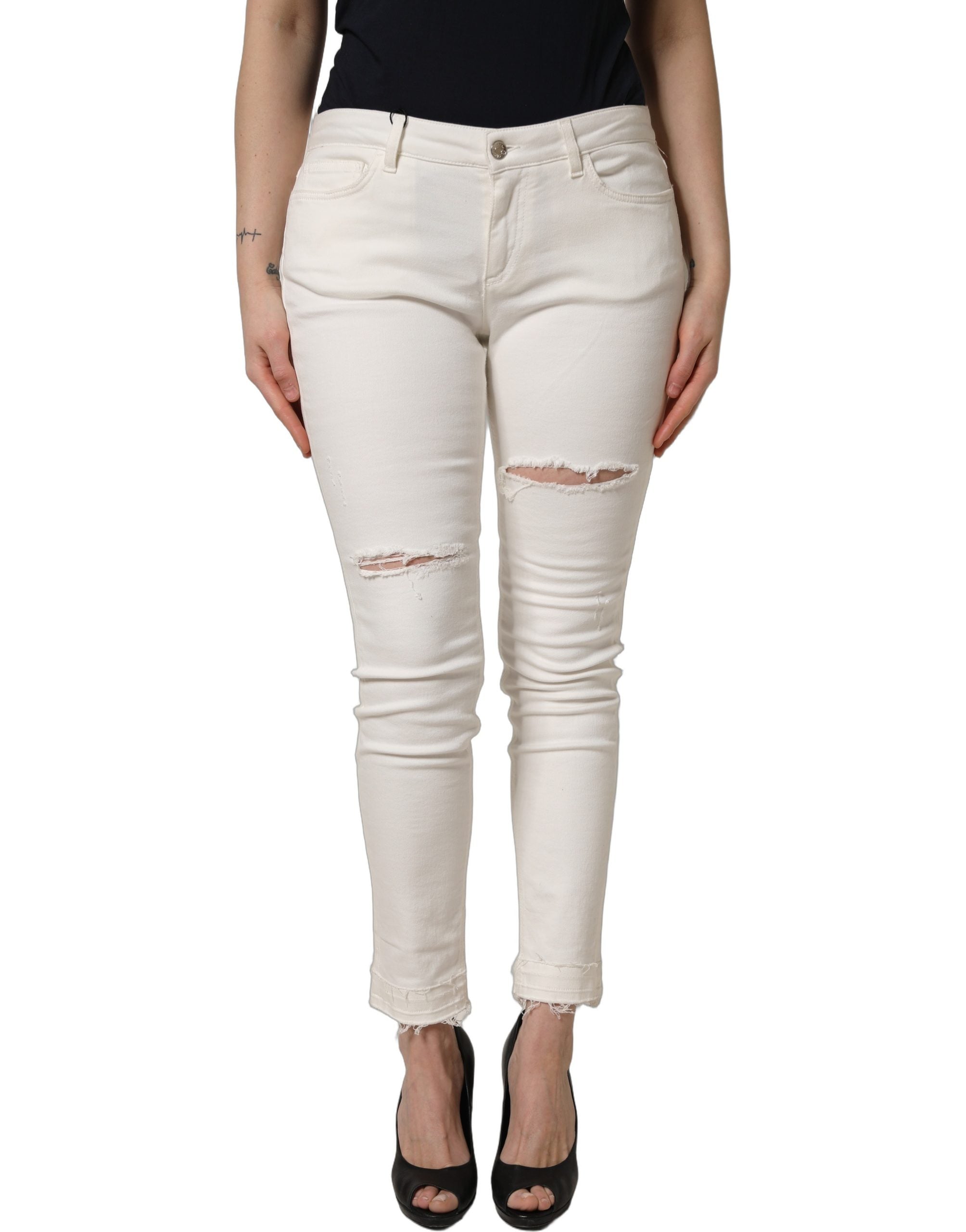 Jeans skinny en coton déchiré blanc Dolce & Gabbana, style moderne et tendance, visibles avec détails usés et coupe ajustée.