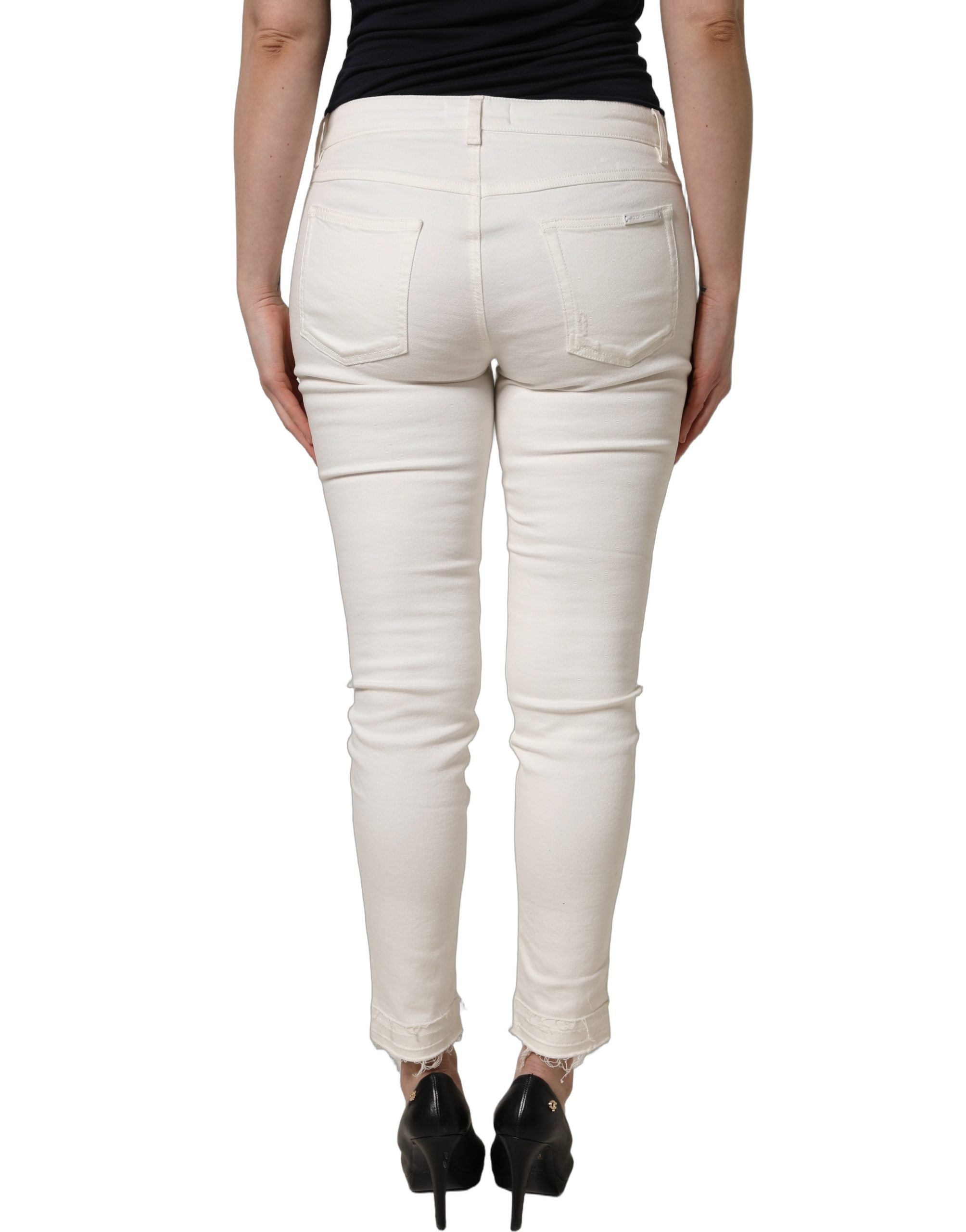 Jeans skinny en coton déchiré blanc de Dolce & Gabbana, style décontracté avec détails usés.