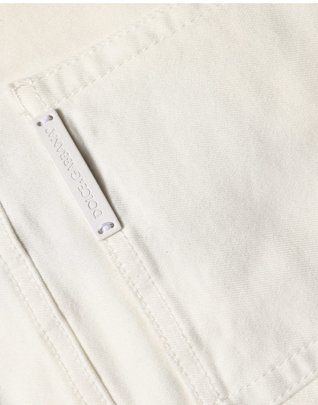 Jeans skinny en coton déchiré blanc Dolce & Gabbana, coupe ajustée et style décontracté, visibles avec détails usés.
