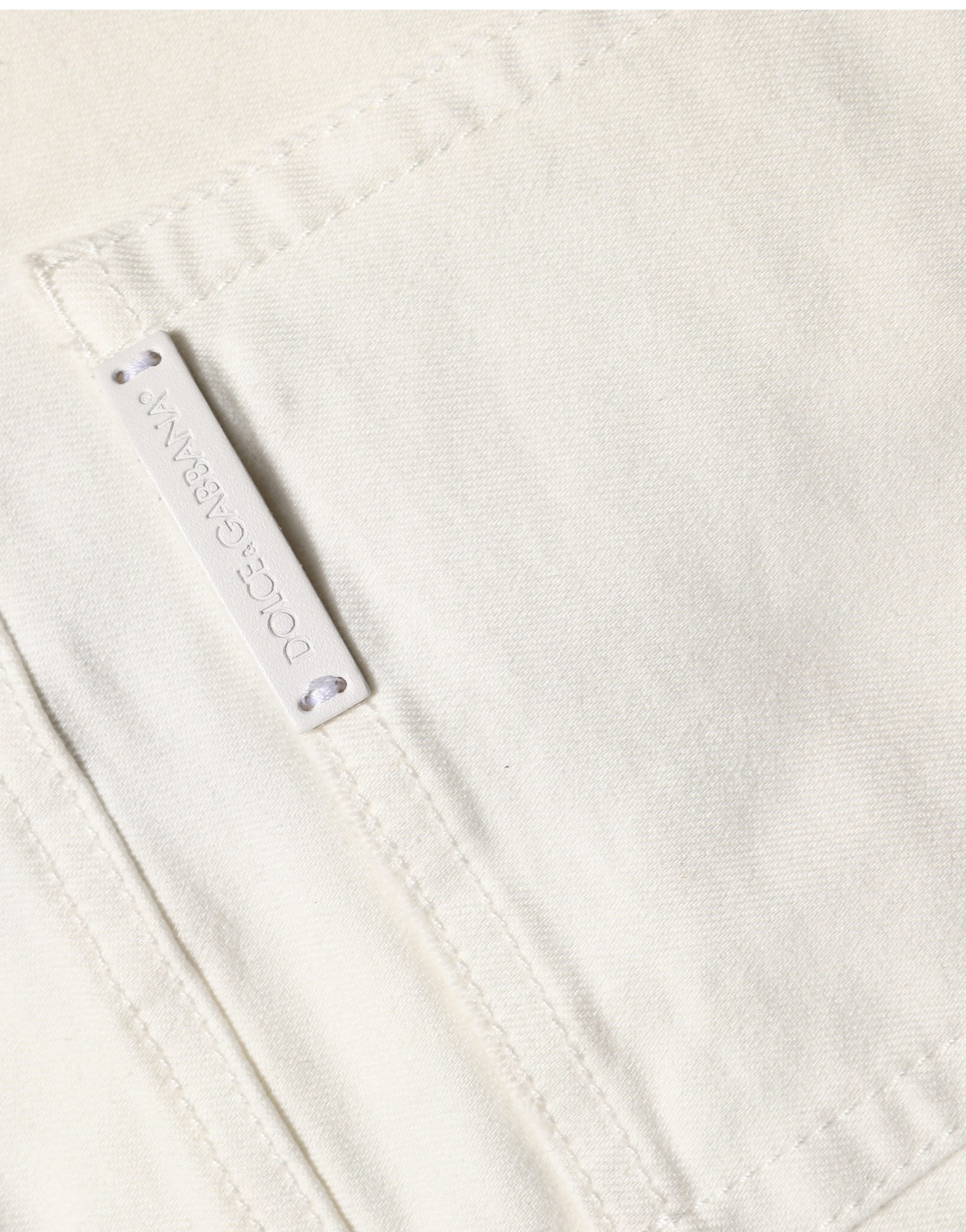 Jeans skinny en coton déchiré blanc Dolce & Gabbana, coupe ajustée et style décontracté, visibles avec détails usés.
