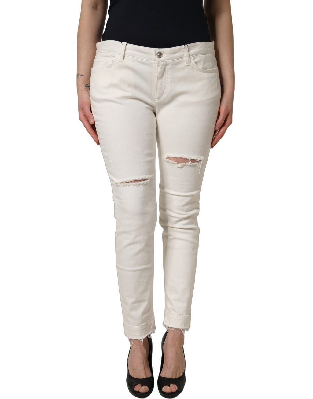 Jeans skinny en coton déchiré blanc Dolce & Gabbana, style moderne et tendance, visibles avec déchirures et coupe ajustée.