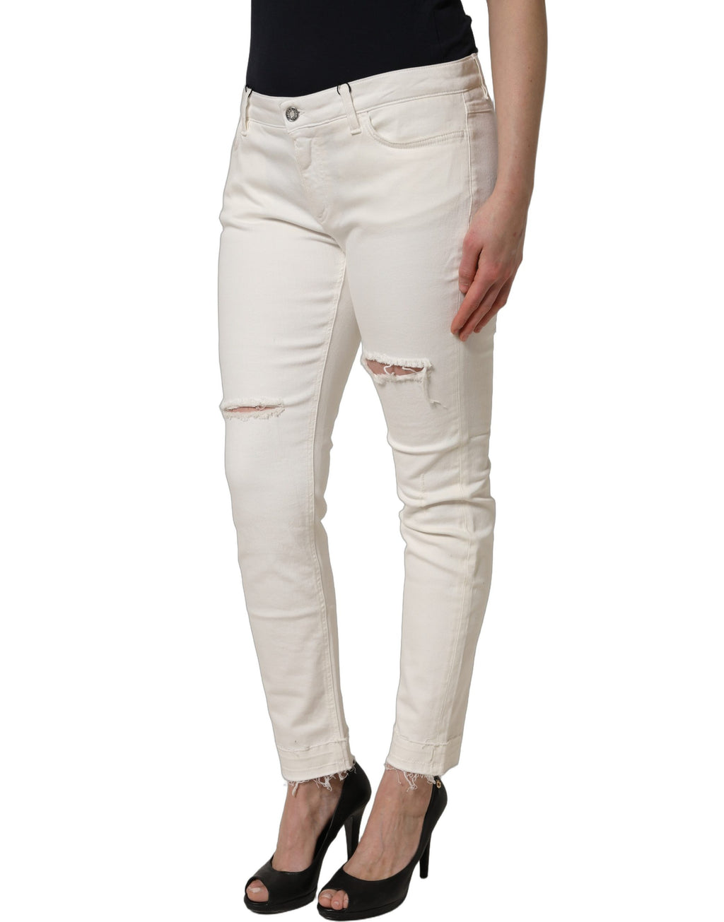 Jeans skinny en coton déchiré blanc de Dolce & Gabbana, style décontracté et tendance, visible avec détails usés sur le denim.