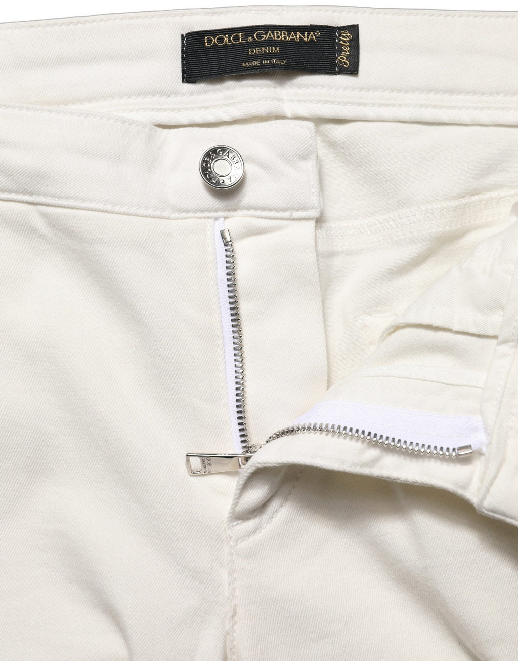 Jeans skinny en coton déchiré blancs de Dolce & Gabbana, style décontracté avec finition usée, vue de face.