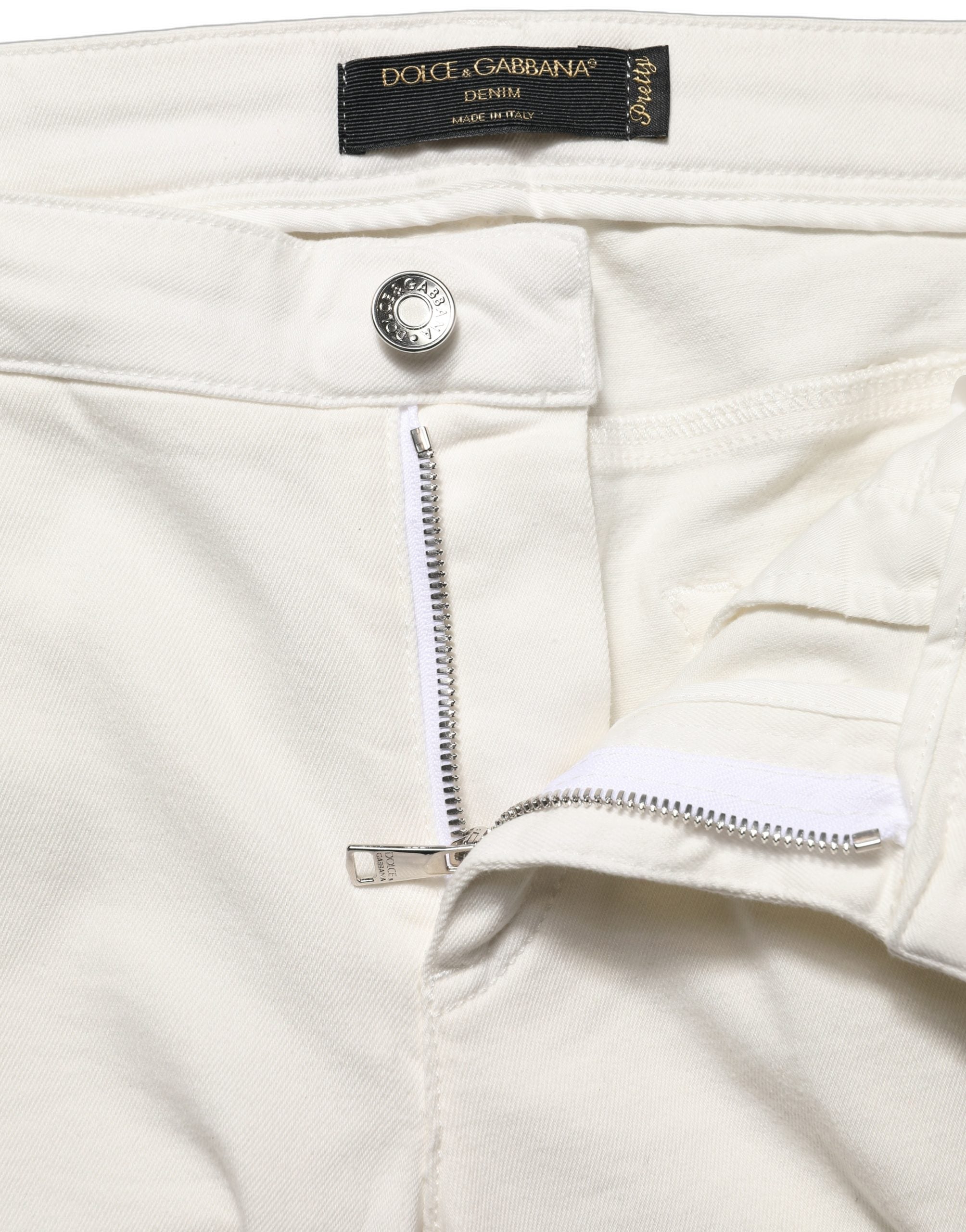 Jeans skinny en coton déchiré blancs de Dolce & Gabbana, style décontracté avec finition usée, vue de face.