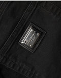 Jean skinny en coton noir à taille haute de Dolce & Gabbana, coupe ajustée et élégante, visible sur un mannequin.