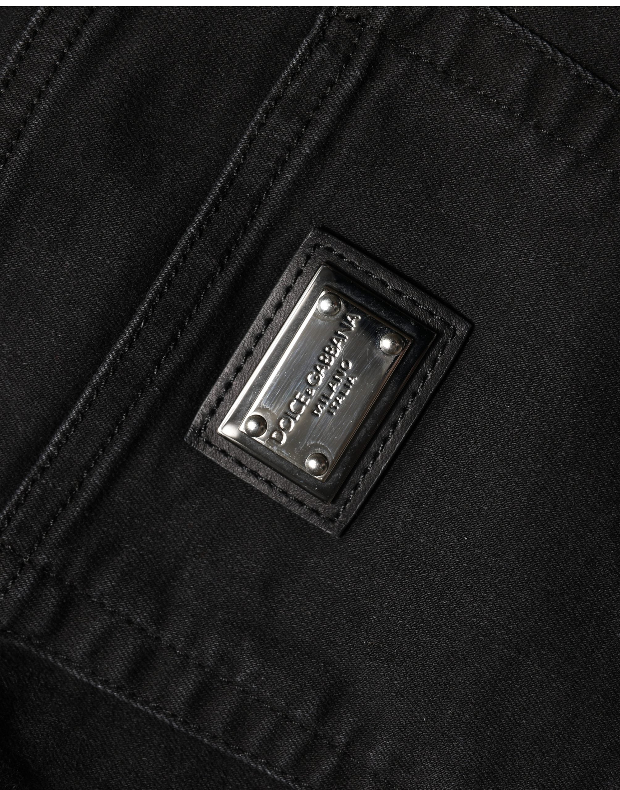 Jean skinny en coton noir à taille haute de Dolce & Gabbana, coupe ajustée et élégante, visible sur un mannequin.