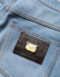 Jeans en denim coton bleus distressed à plis de Dolce & Gabbana, style décontracté et tendance.