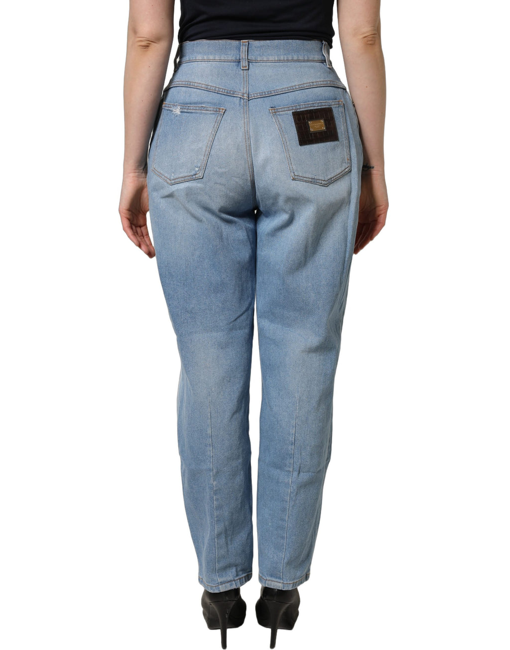 Jeans en denim coton bleu déchiré à plis de Dolce & Gabbana, style décontracté et tendance.
