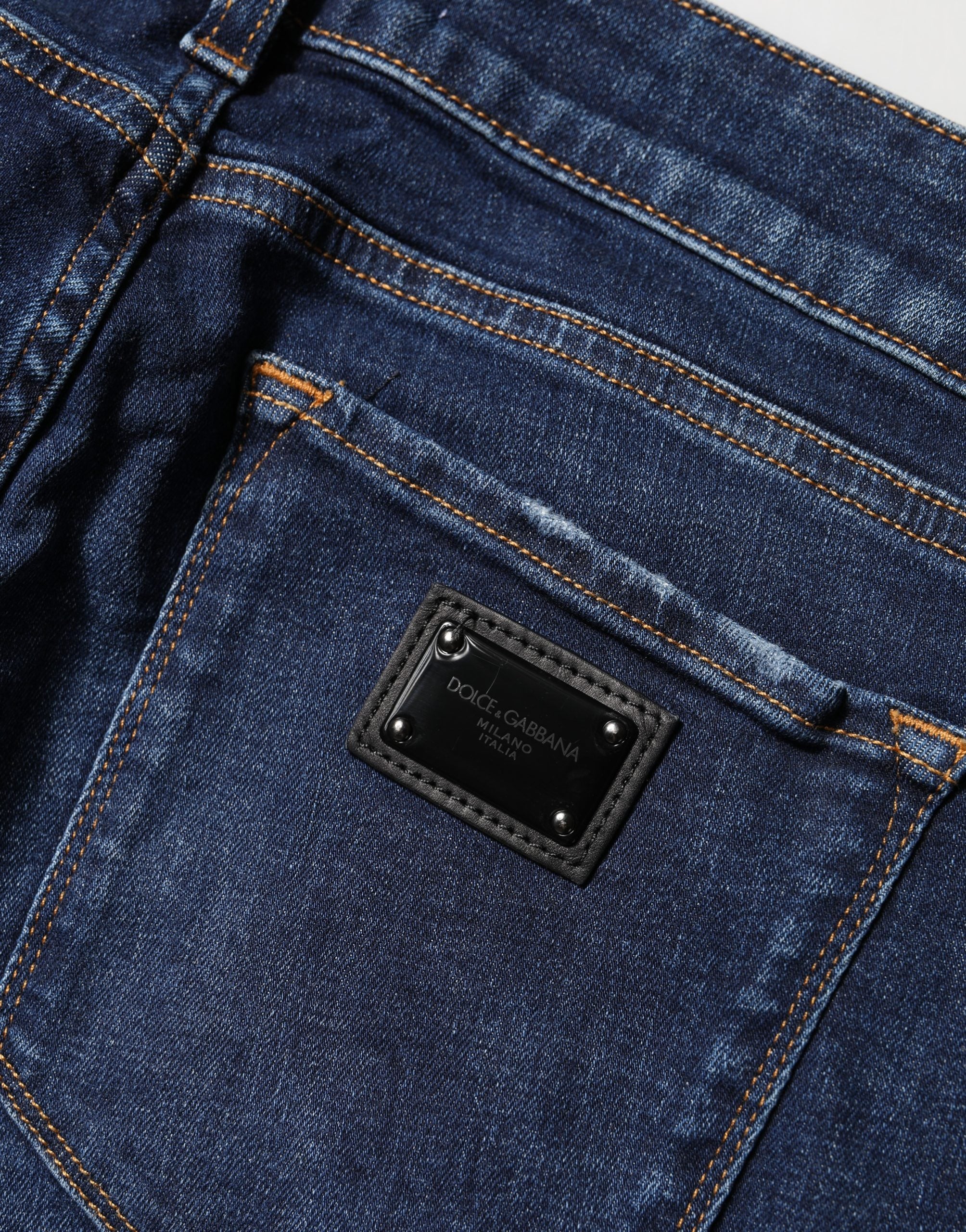 Jeans skinny en coton denim bleu délavé de Dolce & Gabbana, style distressed, pour femme.