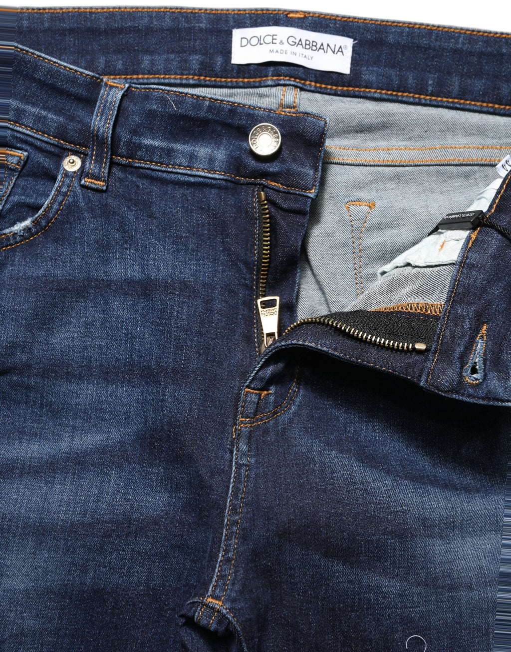 Jean skinny bleu Dolce & Gabbana en coton déchiré, coupe ajustée et style décontracté.