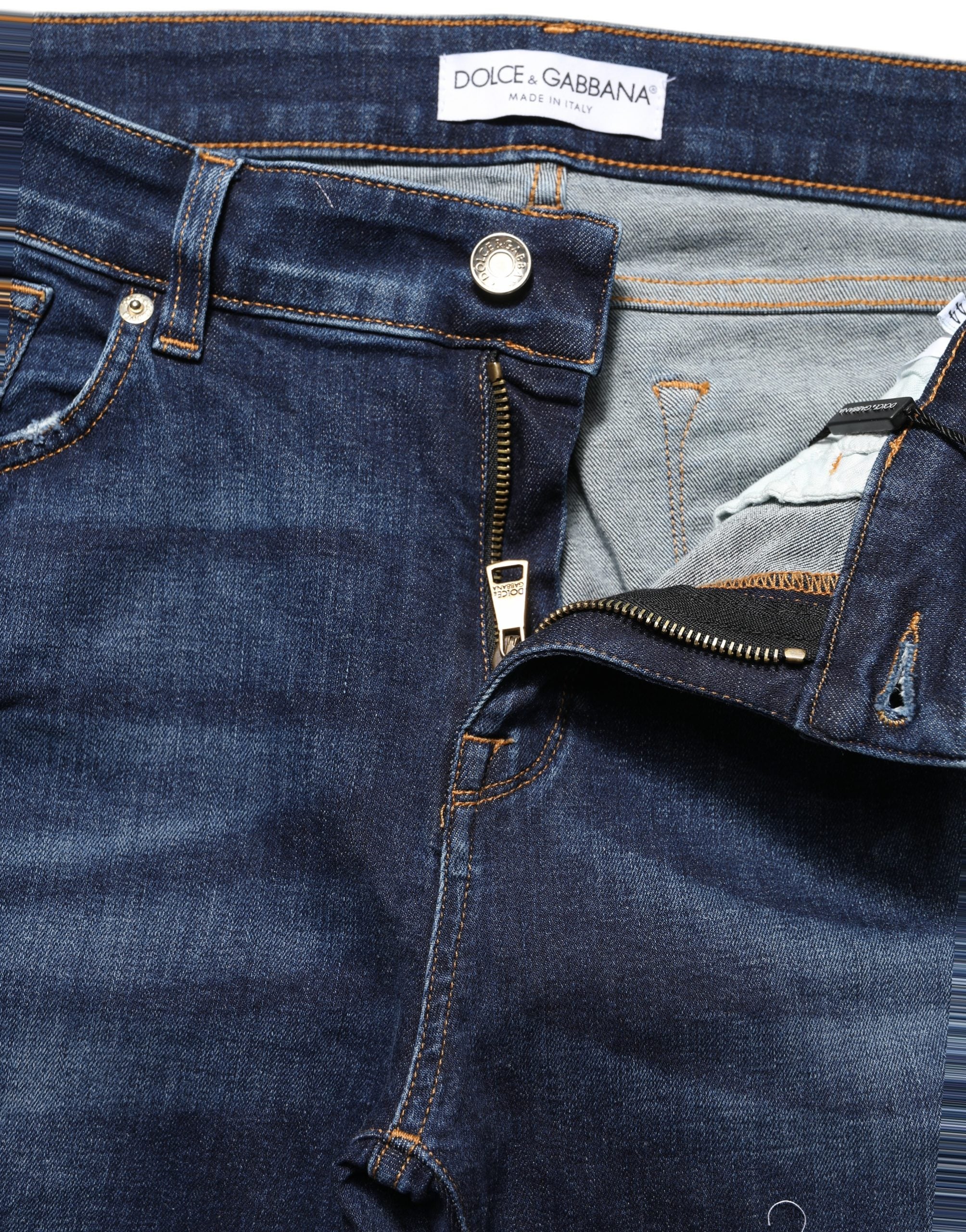 Jean skinny bleu Dolce & Gabbana en coton déchiré, coupe ajustée et style décontracté.