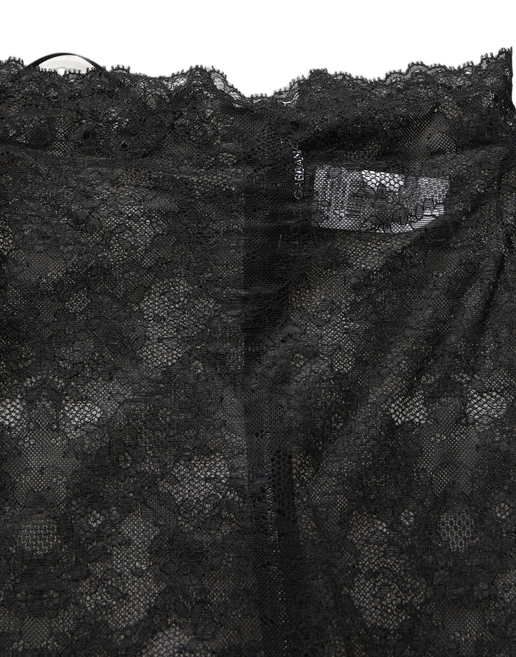 Jupe longue blanche à fleurs en dentelle noire de Dolce & Gabbana, taille haute, longueur genou, élégante et sophistiquée.