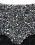 Shorts Dolce & Gabbana en cuir noir à taille haute avec strass, mode chic et glamour visible sur cette image.