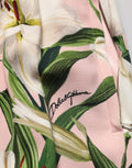 Jupe crayon rose Dolce & Gabbana avec imprimé Lilium à taille haute, élégante et féminine, en tissu fluide.