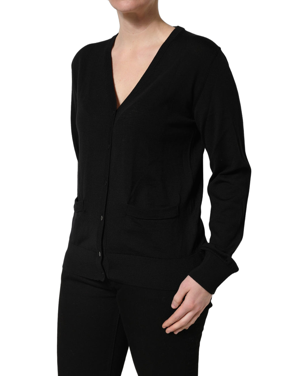 Cardigan noir en laine boutonnée de Dolce & Gabbana, style élégant avec détails en tricot.