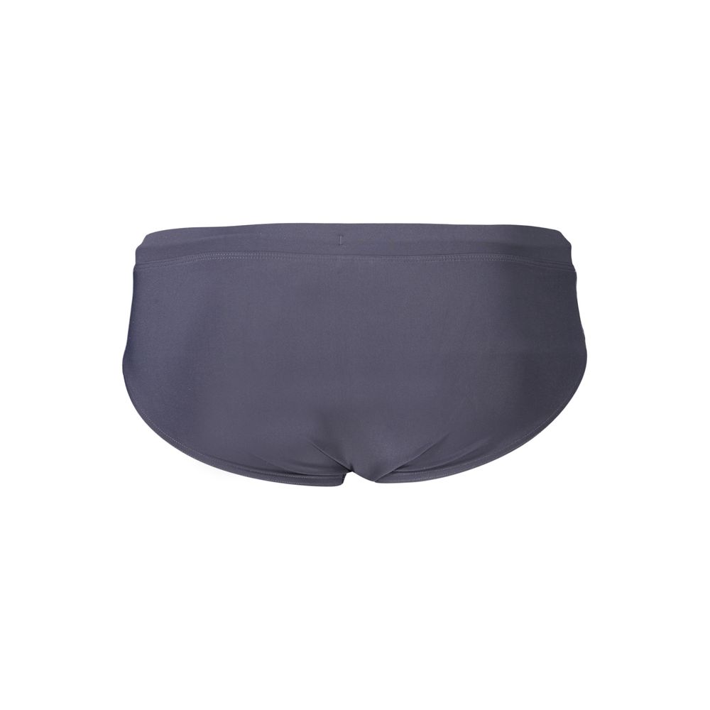 Maillot de bain homme Tommy Hilfiger en polyester bleu avec motif à rayures, conçu pour la plage et la piscine.