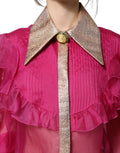 Blouse en chiffon rose fuchsia transparente avec boutons de la marque Dolce & Gabbana, manches longues et coupe fluide.