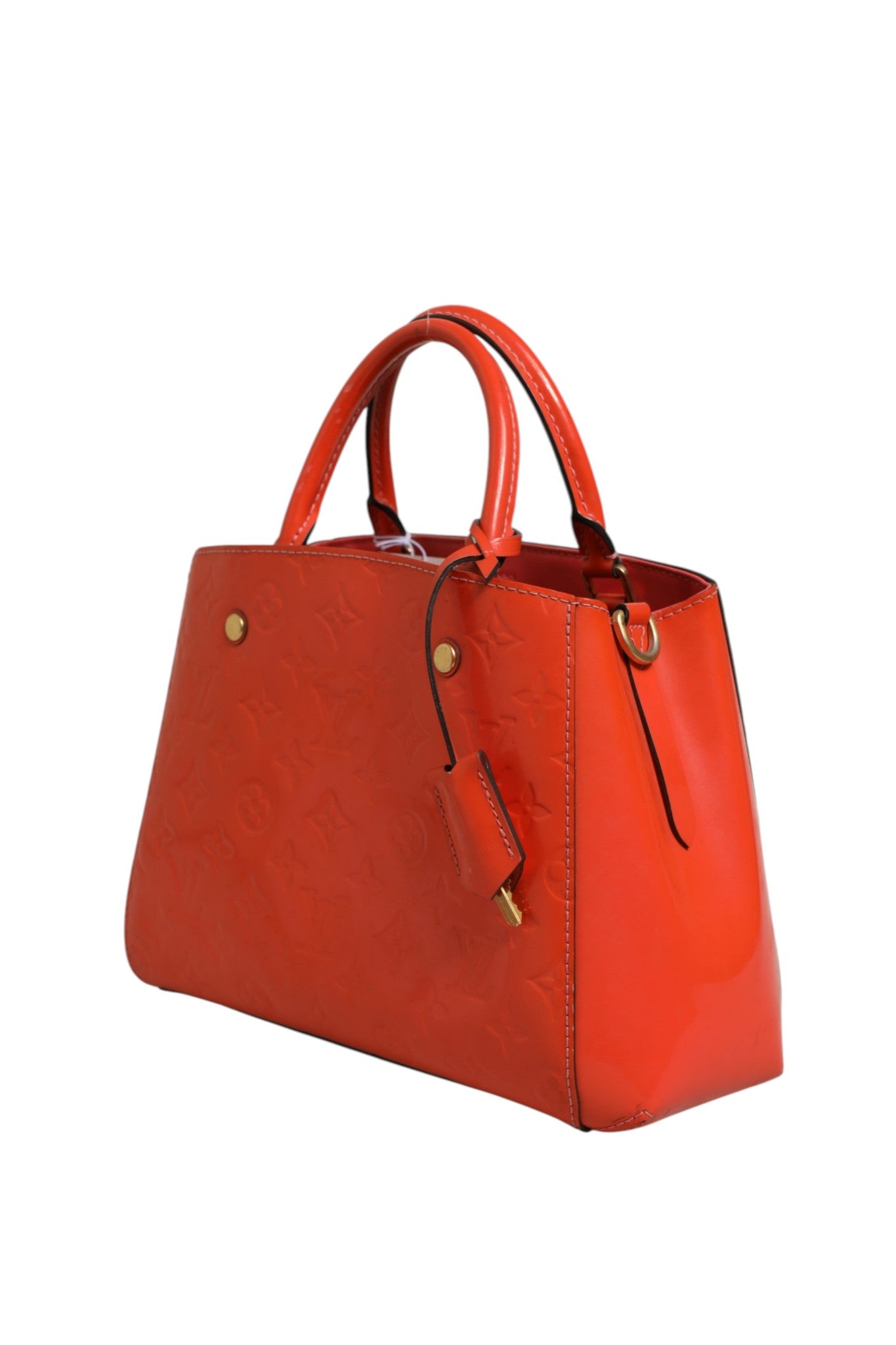 Sac Louis Vuitton Montaigne en cuir avec poignées doubles et fermeture métallique, vue de face sur fond neutre.