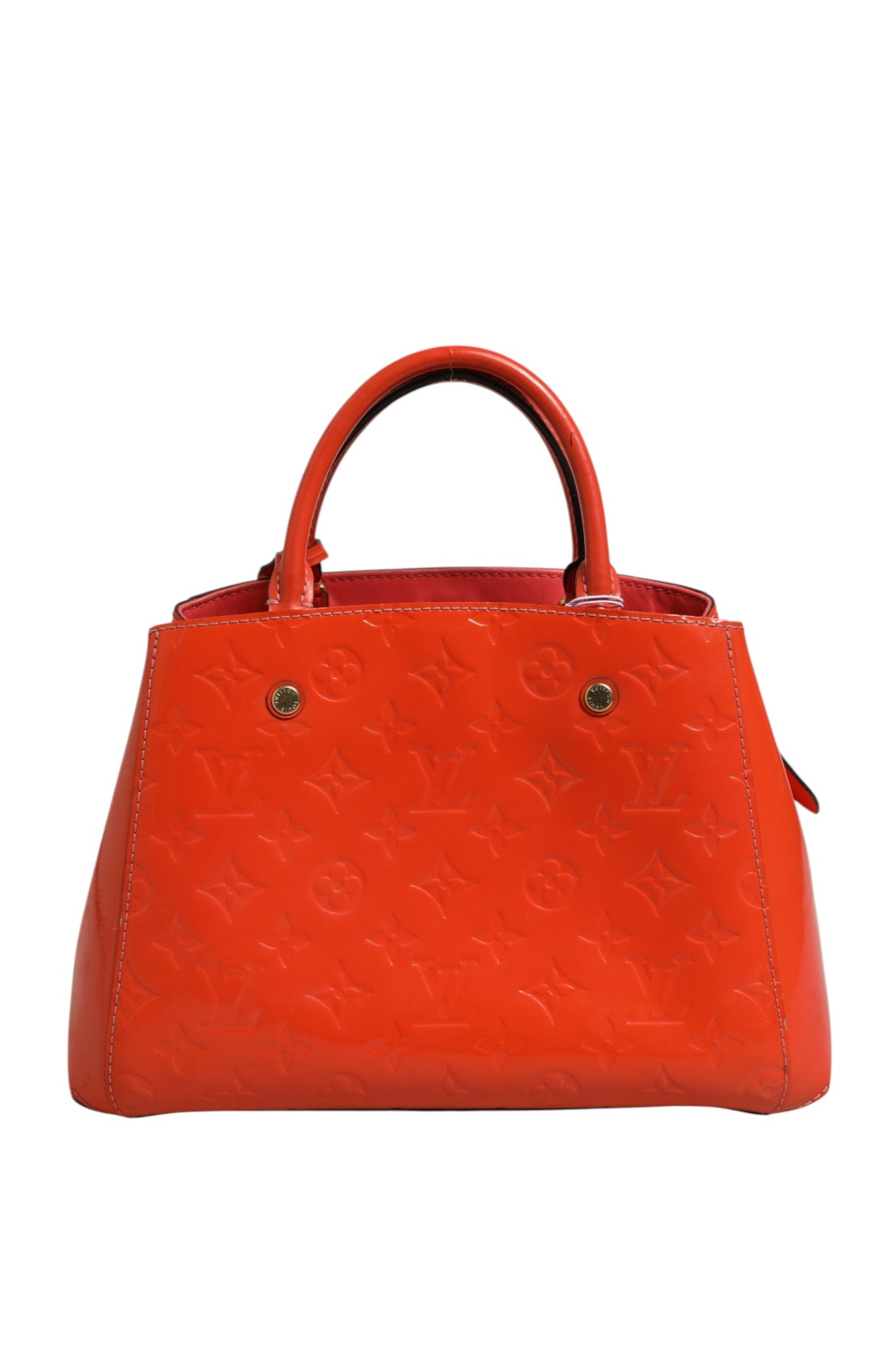 Sac Louis Vuitton Montaigne en cuir monogrammé avec poignées doubles et fermeture en métal, élégant et sophistiqué.