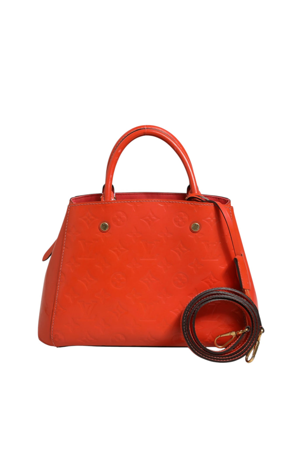 Sac Louis Vuitton Montaigne en cuir avec poignées courbes et logo LV visible, posé sur une surface claire.