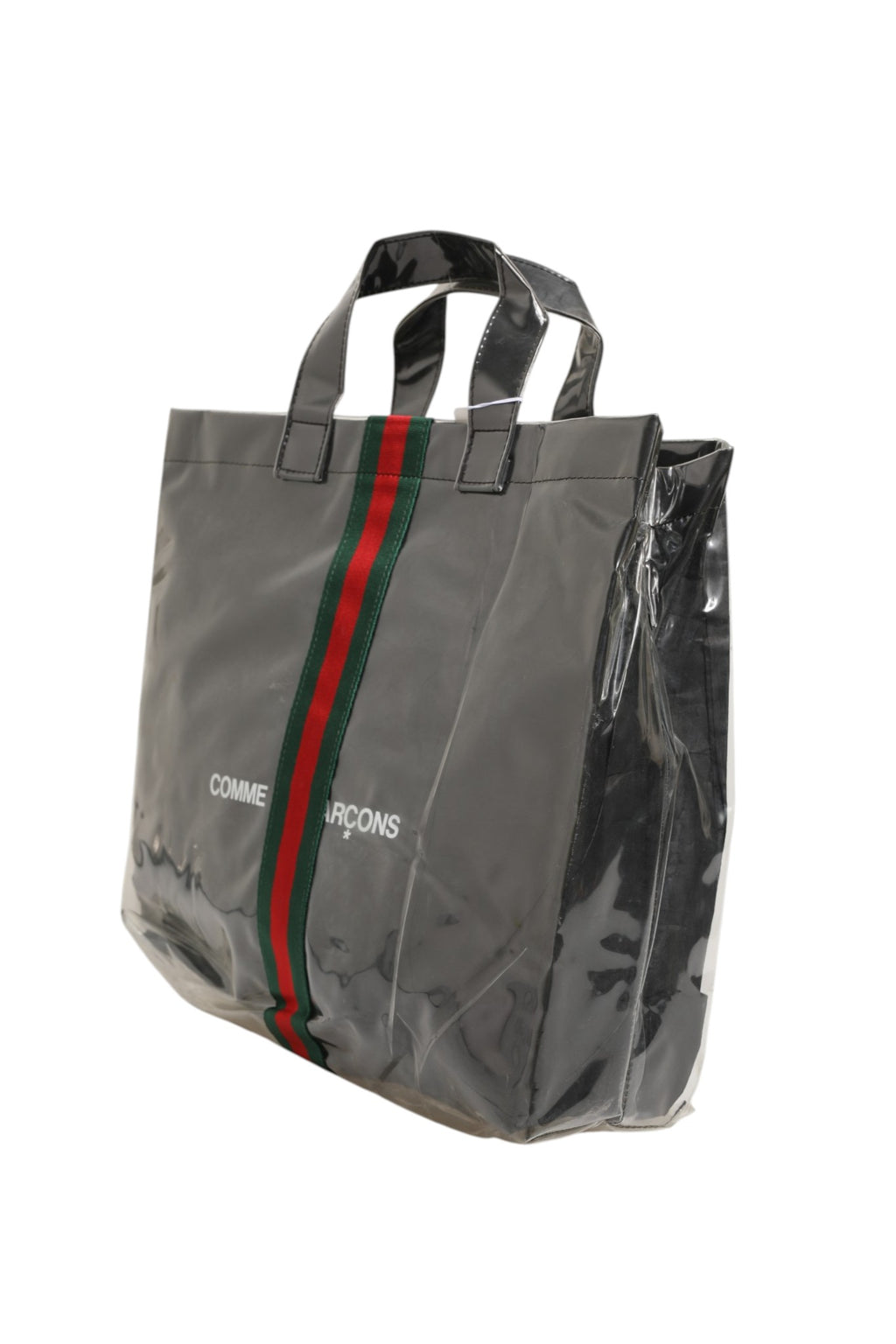 Sac cabas Gucci GG x Comme des Garçons avec logo, en toile noire et détails colorés, visible sur l'image.
