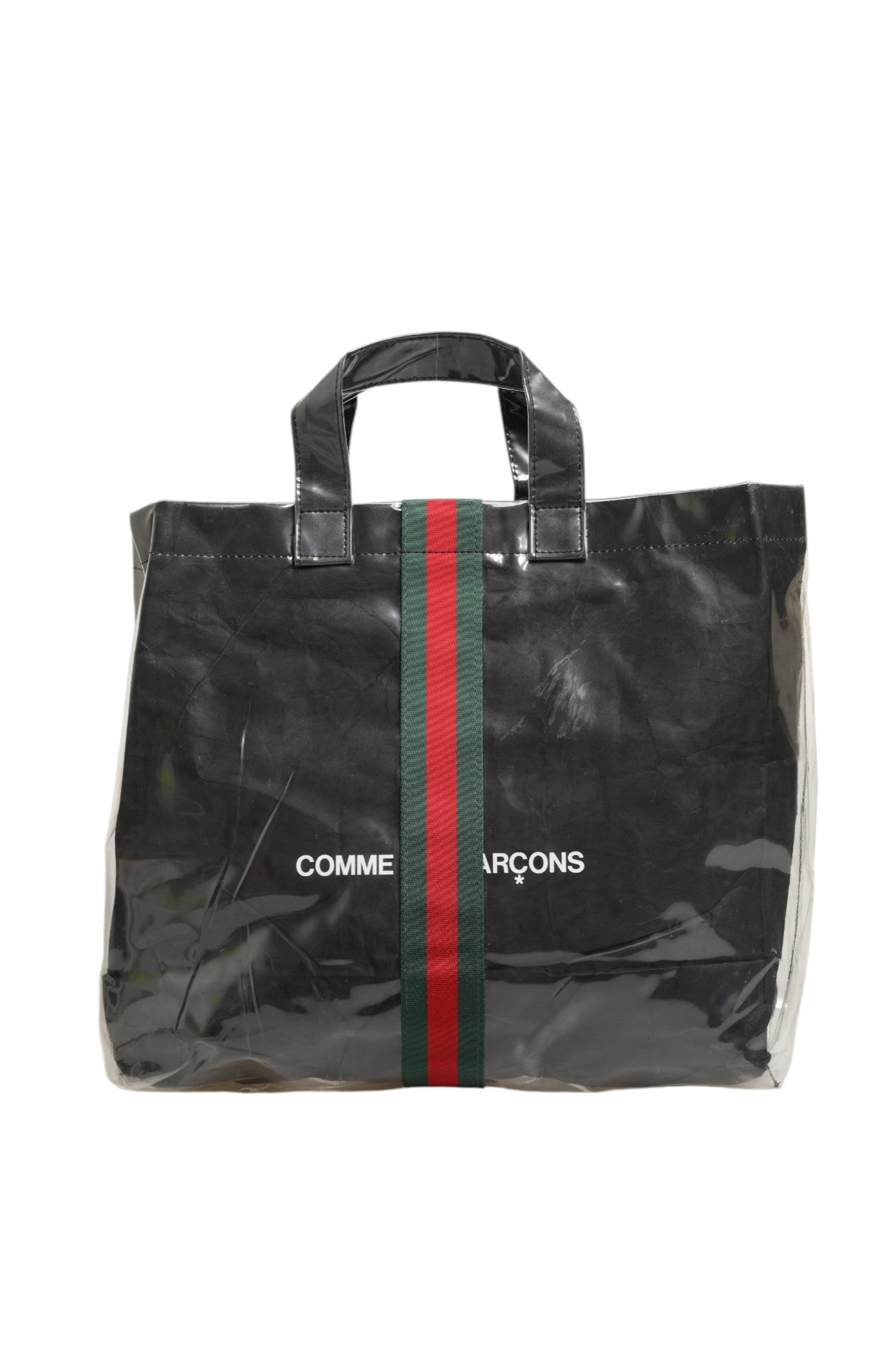 Grand sac cabas Gucci GG x Comme des Garçons avec logo emblématique et design graphique, en tissu durable et élégant.