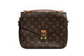 Pochette Métis Louis Vuitton monogramme en toile avec poignée en cuir et fermeture métallique, vue de face.