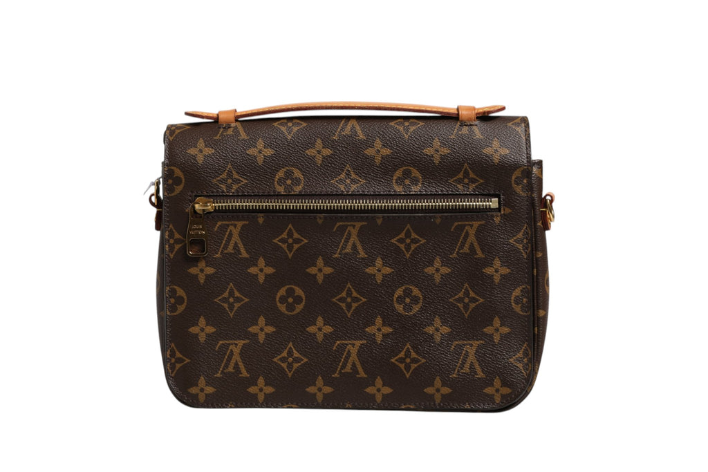 Pochette Métis Monogram de Louis Vuitton avec bandoulière en cuir et motif monogramme classique, vue de face.
