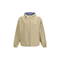 Veste en polyamide recyclé beige de Prada, coupe-vent avec capuche et fermeture éclair, vue de face.