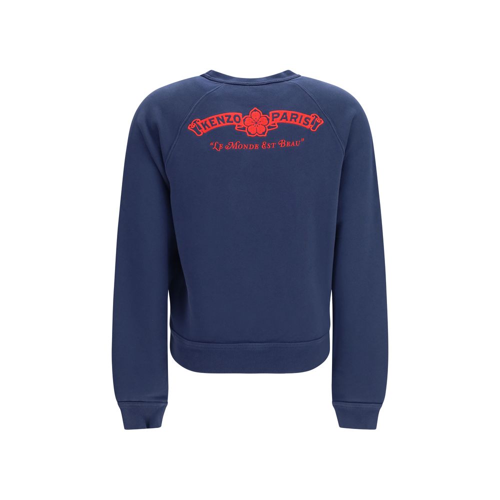 Sweat-shirt en coton bleu de la marque Kenzo, avec logo discret, porté sur un modèle, vue de face.