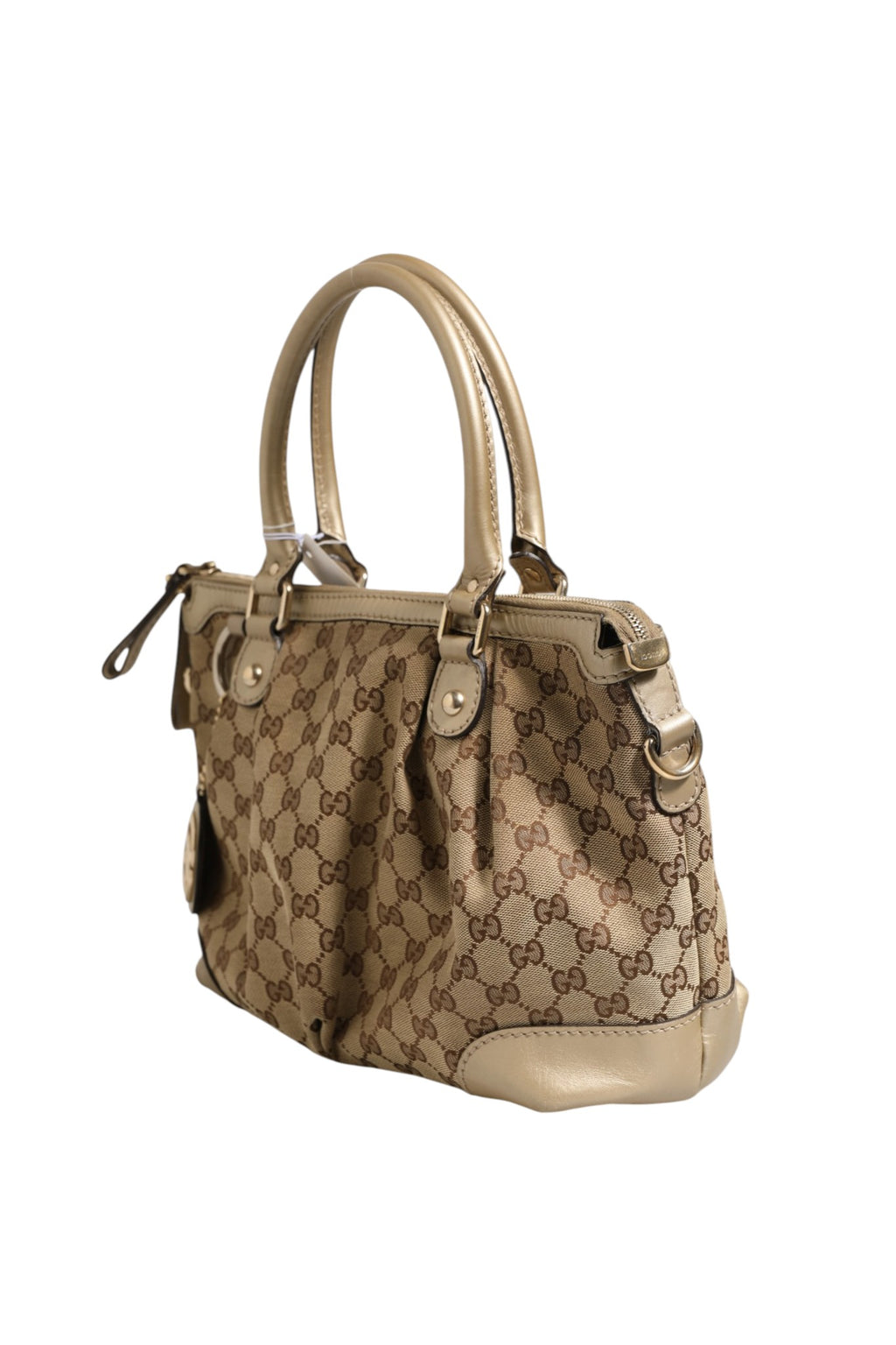 Sac Gucci Sukey en toile canvas à bandoulière et poignées, avec logo Gucci visible, style élégant et pratique.