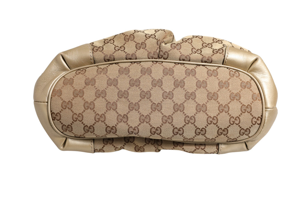 Sac Gucci Sukey en toile à deux compartiments, avec logo Gucci visible, style élégant et pratique pour un usage quotidien.