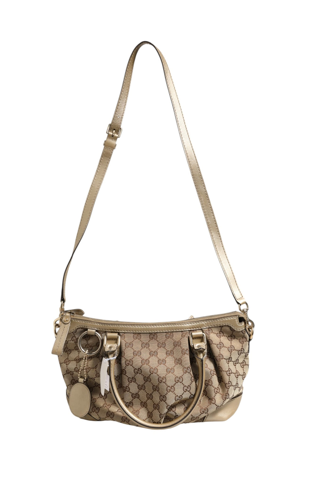 Sac à main Gucci Sukey Canvas 2 voies avec poignées et bandoulière, en toile avec logo Gucci visible.