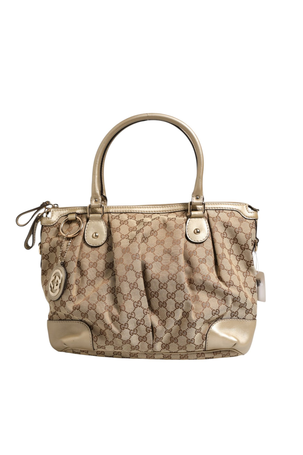 Sac à main Gucci Canvas Sukey Satchel avec bandoulière en toile et détails en cuir, logo Gucci visible.