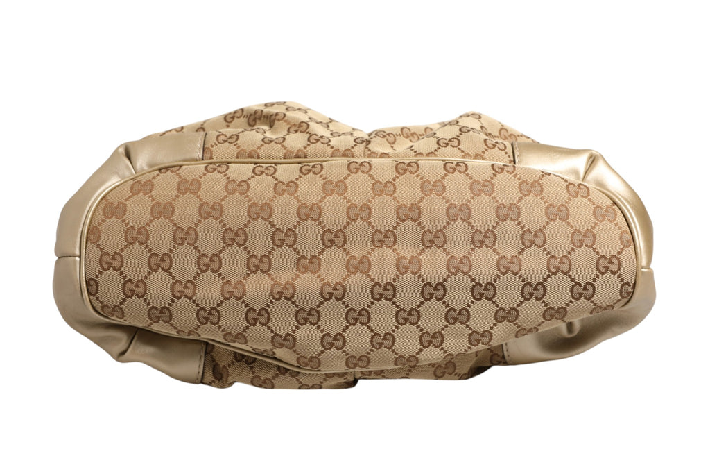 Sac à main Gucci Sukey en toile, avec détails en cuir et logo Gucci, élégant et tendance.