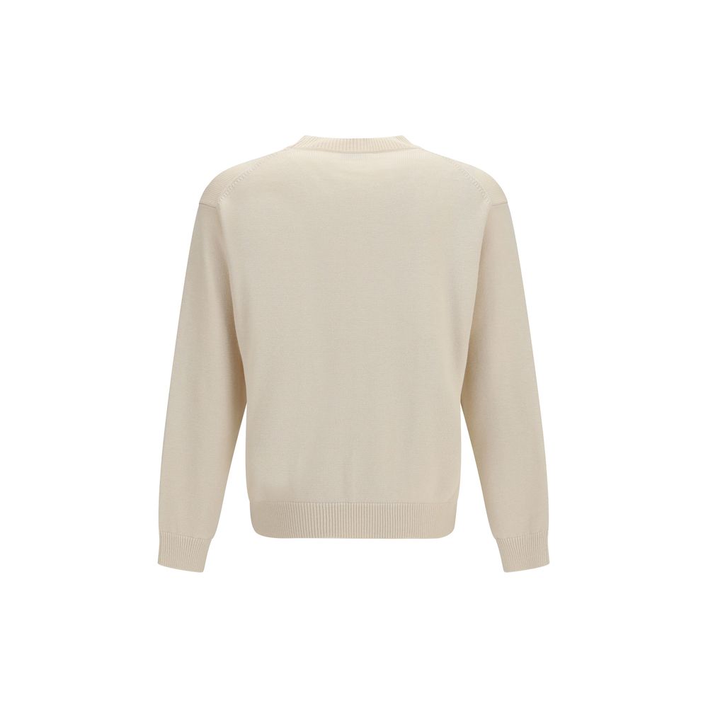 Sweatshirt beige en coton de la marque Kenzo, tissu doux et confortable, portée décontractée avec logo visible.