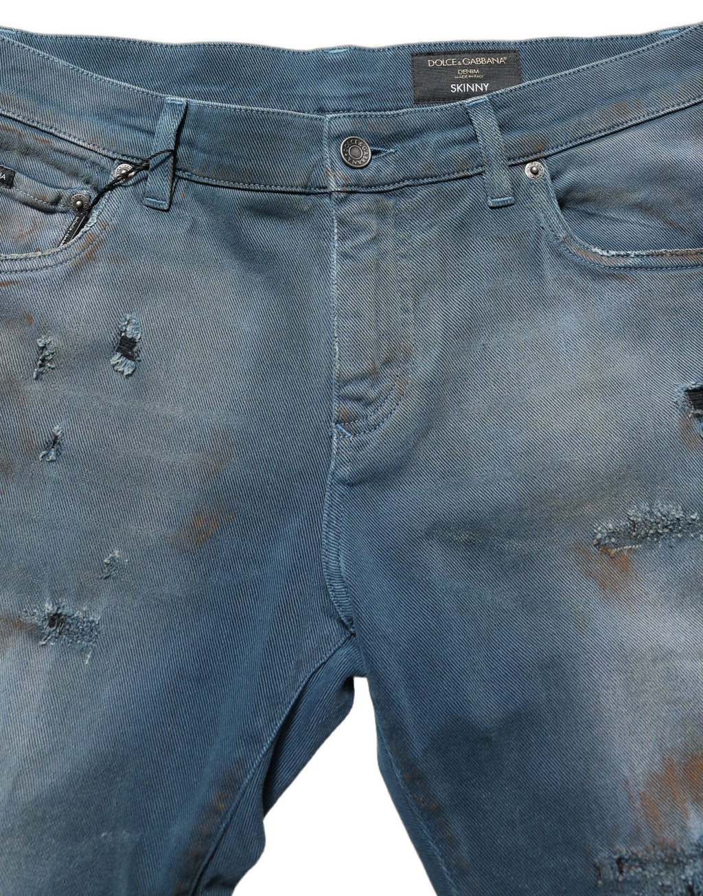 Jeans skinny en denim bleu délavé à taille moyenne de Dolce & Gabbana, coupe ajustée, détails déchirés sur le devant.