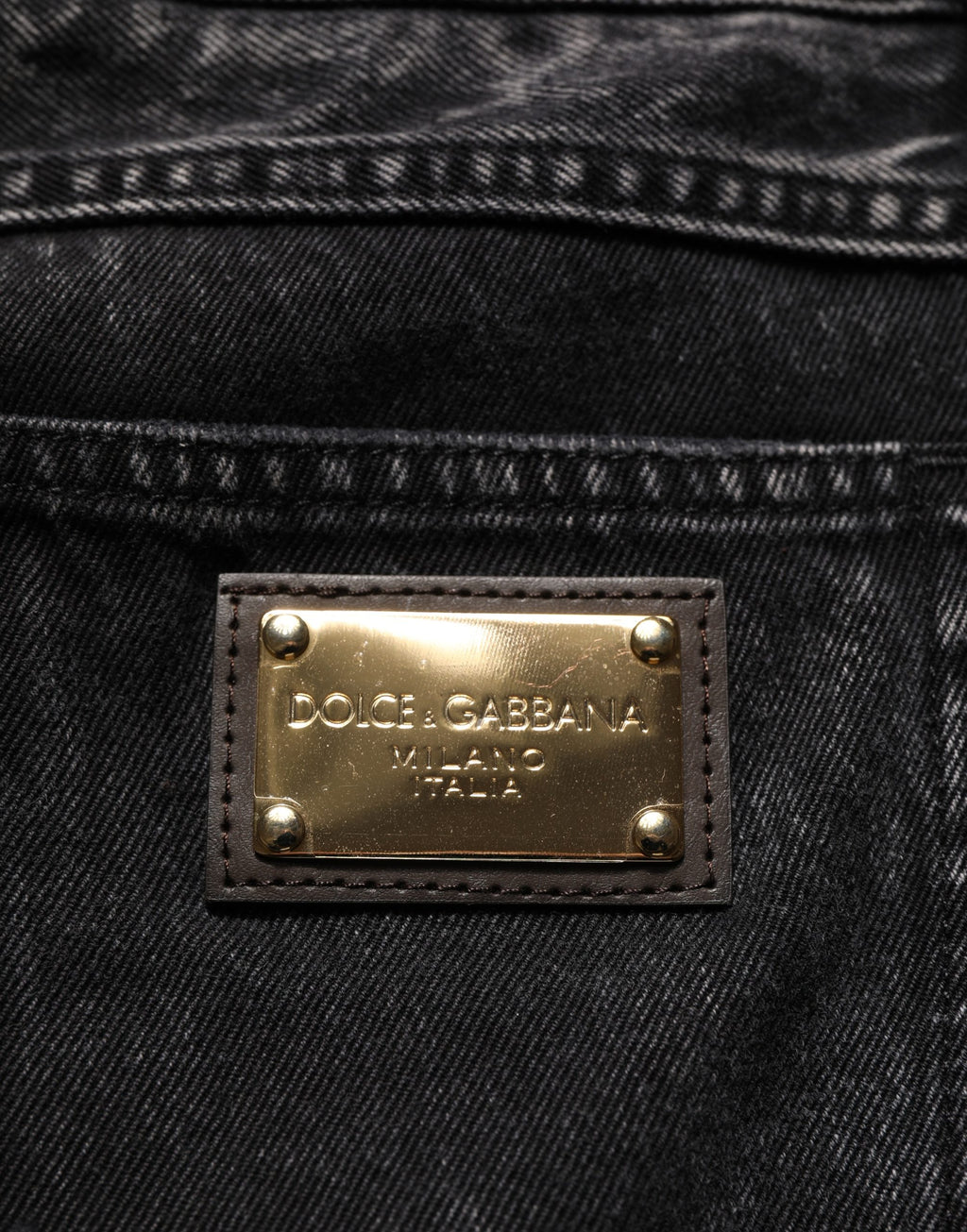 Jeans droits en denim noir délavé en coton de Dolce & Gabbana, style décontracté avec détails usés visibles.