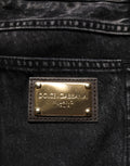 Jeans droits en denim noir délavé en coton de Dolce & Gabbana, style décontracté avec détails usés visibles.