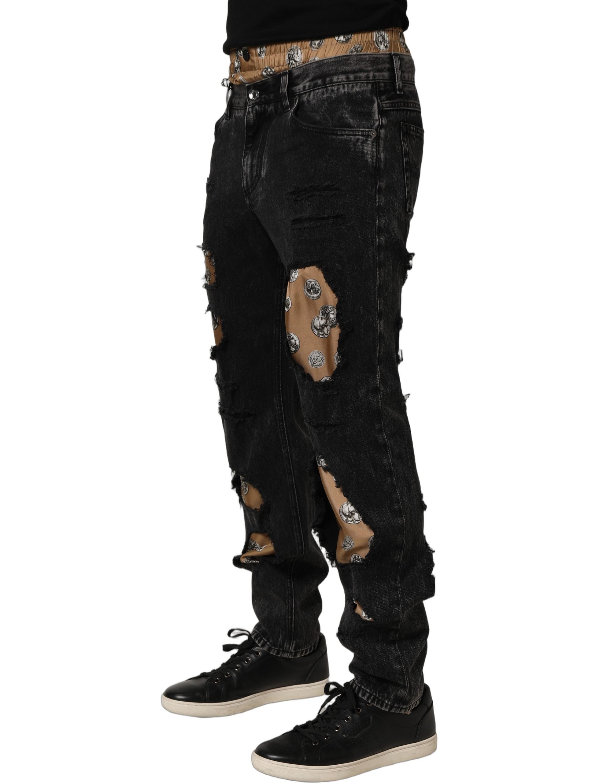 Jean droit en denim noir délavé de Dolce & Gabbana, coton distressed, coupe élégante et moderne.