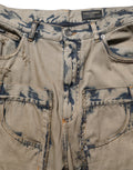 Jeans décontractés beige décolorés pour homme de Dolce & Gabbana, denim déstructuré avec style moderne et détails uniques.