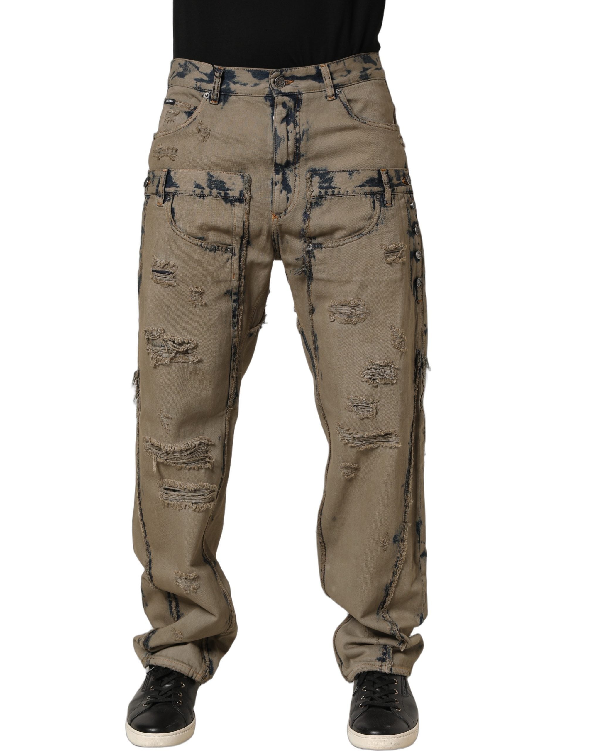 Jeans décontractés pour homme Dolce & Gabbana beige décolorés et déstructurés en denim, visibles avec détails usés et coupe moderne.