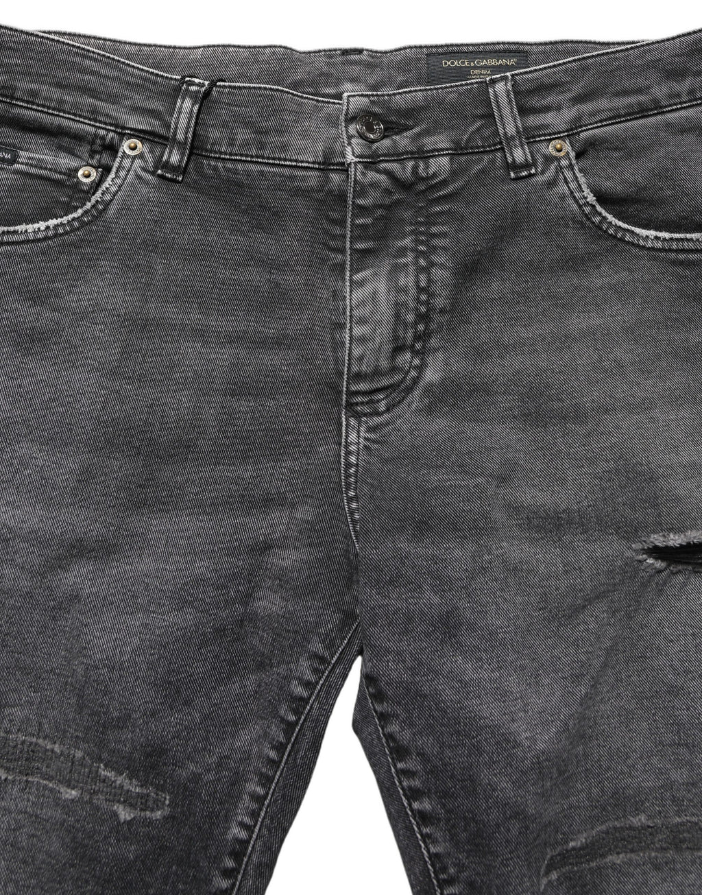 Jeans en denim gris foncé délavé de taille moyenne de Dolce & Gabbana, avec un style déchiré et usé.
