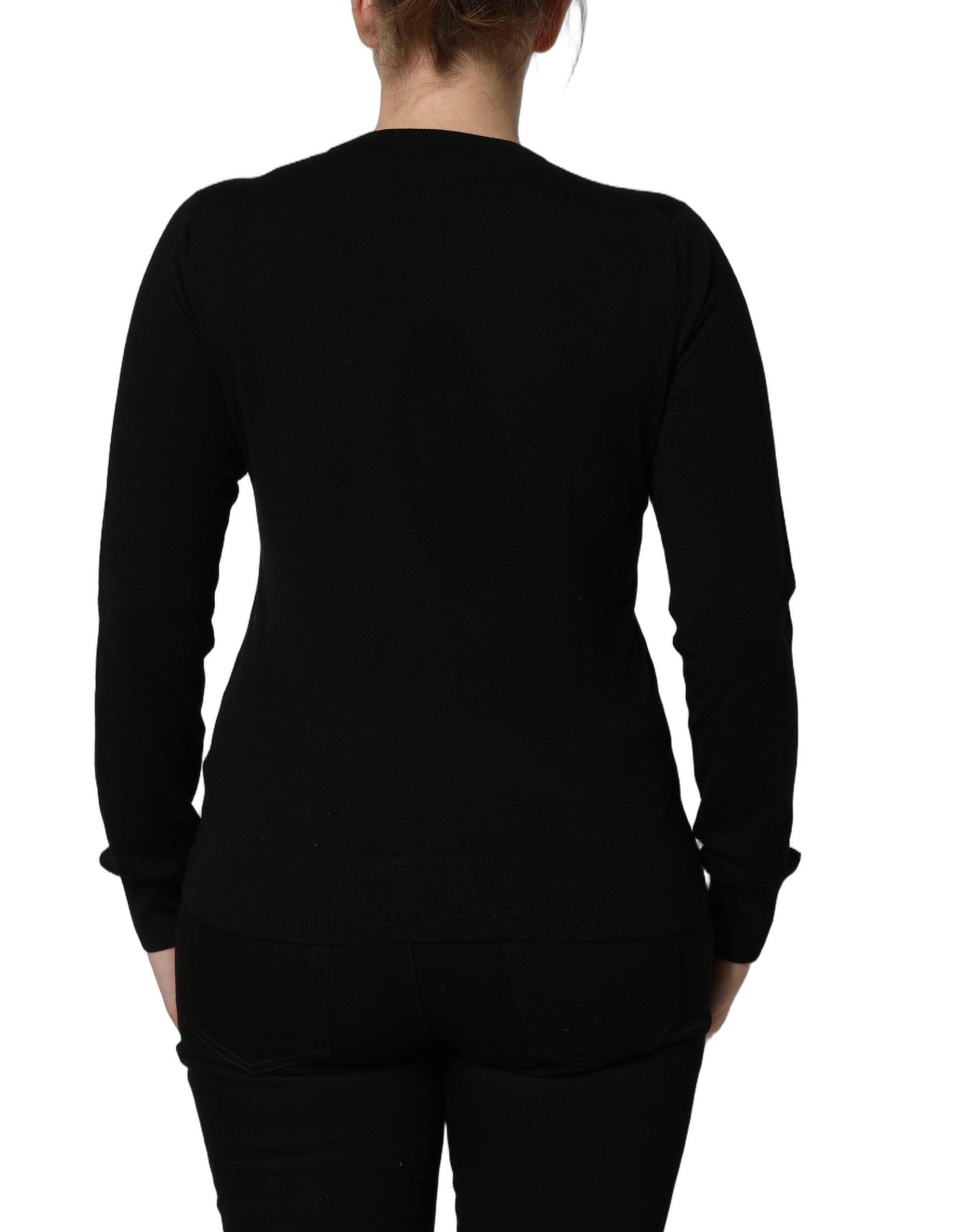 Pull-over en laine noir Dolce & Gabbana avec motifs d'anges, col rond, style élégant et confortable.